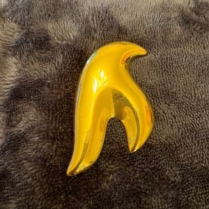 Gold tone abstract pin.